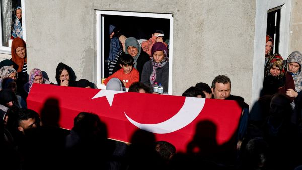 Mourners react during the funeral ceremony for Ridvan Acet, one of the miners who died after an explosion in a coal mine in Amasra, in Turkey's Bartin Province, on October 15, 2022. (Photo by Yasin AKGUL / AFP) coal mine