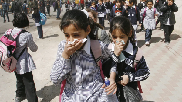 Palestinian school girls in Hebron run away from gas canisters 