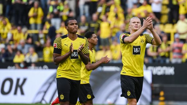 Dortmund's Swiss defender Manuel Akanji and Dortmund's Norwegian forward Erling Braut Haaland react prior to the German first division Bundesliga football match between Borussia Dortmund and Eintracht Frankfurt in Dortmund, western Germany, on August 14, 2021. (Photo by Ina Fassbender / AFP)