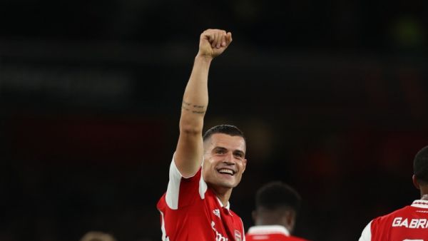 Arsenal's Swiss midfielder Granit Xhaka celebrates after scoring the opening goal of the UEFA Europa League Group A football match between Arsenal and PSV Eindhoven at The Arsenal Stadium in London, on October 20, 2022. (Photo by ADRIAN DENNIS / AFP)
