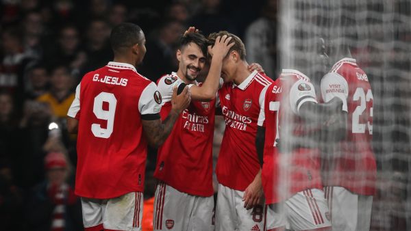 Arsenal's Portuguese midfielder Fabio Vieira (2nd L) celebrates with teammates after scoring his team third goal during the UEFA Europa League Group A football match between Arsenal and Bodoe/Glimt at The Arsenal Stadium in London, on October 6, 2022. (Photo by Daniel LEAL / AFP)