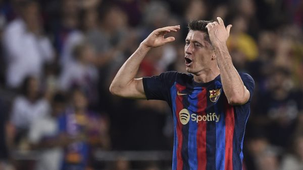 Barcelona's Polish forward Robert Lewandowski celebrates scoring his team's second goal during the Spanish league football match between FC Barcelona and Villarreal CF at the Camp Nou stadium in Barcelona on October 20, 2022. (Photo by Josep LAGO / AFP)