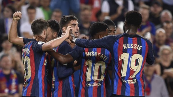 Barcelona's Spanish forward Ferran Torres celebrates scoring his team's fourth goal with teammates during the Spanish league football match between FC Barcelona and Athletic Club Bilbao at the Camp Nou stadium in Barcelona, on October 23, 2022. (Photo by Josep LAGO / AFP)