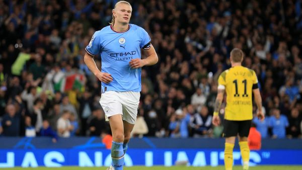 Manchester City's Norwegian striker Erling Haaland celerbates scoring the second goal during the UEFA Champions League group G football match between England's Manchester City and Germany's Borussia Dortmund at the Etihad Stadium in Manchester on September 14, 2022. (Photo by Lindsey Parnaby / AFP)