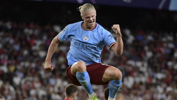 Manchester City's Norwegian striker Erling Haaland celebrates after scoring his team's third goal during the UEFA Champions League Group G first-leg football match between Sevilla FC and Manchester City, at the Ramon Sanchez Pizjuan stadium in Seville on September 6, 2022. (Photo by CRISTINA QUICLER / AFP)