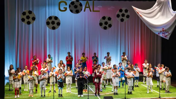 QF students present musical production inspired by world cup