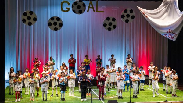 During the event QF students present musical production inspired by world cup