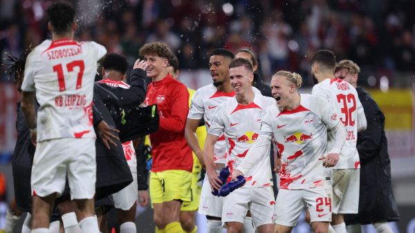 Leipzig's players celebrate after winning the UEFA Champions League Group F football match between RB Leipzig and Real Madrid CF in Leipzig, eastern Germany on October 25, 2022. (Photo by Ronny HARTMANN / AFP)