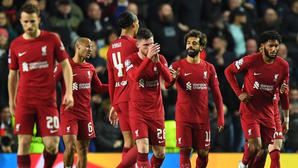 Liverpool's Egyptian striker Mohamed Salah (3R) celebrates scoring his team's sixth goal during the UEFA Champions League Group A football match between Glasgow Rangers and Liverpool at the Ibrox Stadium, in Glasgow, on October 12, 2022. (Photo by ANDY BUCHANAN / AFP)