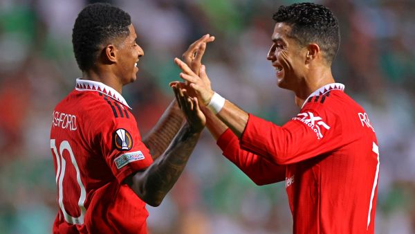(R to L) Manchester United's Portuguese striker Cristiano Ronaldo and Manchester United's English striker Marcus Rashford celebrate together after the latter's goal during the UEFA Europa League group E football match between Cyprus' Omonia Nicosia and England's Manchester United at GSP stadium in the capital Nicosia on October 6, 2022. (Photo by AFP)