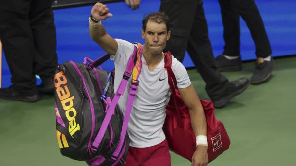 Spain's Rafael Nadal waves as he leaves the court after being defeated by USA's Frances Tiafoe during a 2022 US Open Tennis tournament men's singles Round of 16 match at the USTA Billie Jean King National Tennis Center in New York on September 5, 2022. (Photo by KENA BETANCUR / AFP)