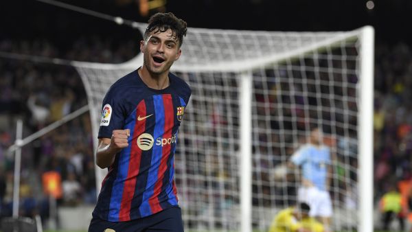Barcelona's Spanish midfielder Pedri celebrates scoring the opening goal during the Spanish League football match between Barcelona FC and RC Celta de Vigo at the Camp Nou stadium in Barcelona on October 9, 2022. (Photo by Josep LAGO / AFP)