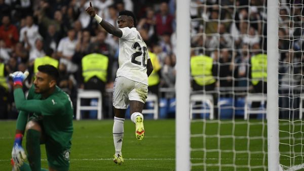Real Madrid's Brazilian forward Vinicius Junior celebrates scoring his team's first goal during the Spanish league football match between Real Madrid CF and Girona FC at the Santiago Bernabeu stadium in Madrid on October 30, 2022. (Photo by PIERRE-PHILIPPE MARCOU / AFP)