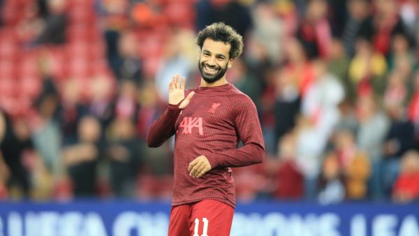 Liverpool's Egyptian striker Mohamed Salah waves to supporters prior to the UEFA Champions League group A football match between Liverpool and Ajax at Anfield in Liverpool, north west England on September 13, 2022. (Photo by Lindsey Parnaby / AFP)