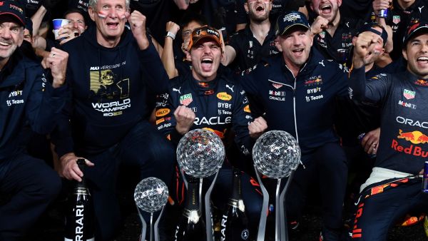 Red Bull Racing's Dutch driver Max Verstappen (front C) celebrates winning the season's world championship with his team after his victory at the Formula One Japanese Grand Prix at Suzuka, Mie prefecture on October 9, 2022. (Photo by Toshifumi KITAMURA / AFP)