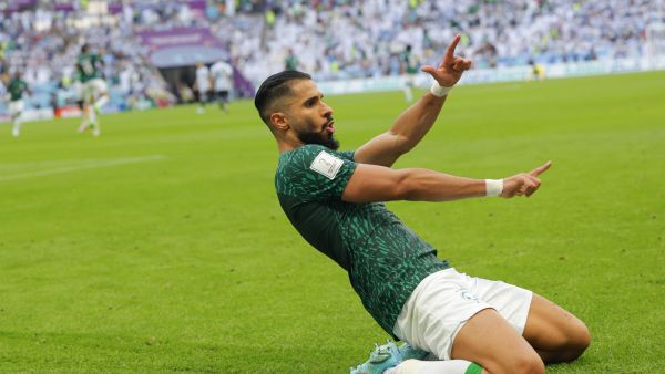 Saudi Arabia's forward #11 Saleh Al-Shehri celebrates after scoring his team's first goal during the Qatar 2022 World Cup Group C football match between Argentina and Saudi Arabia at the Lusail Stadium in Lusail, north of Doha on November 22, 2022. (Photo by Odd ANDERSEN / AFP)