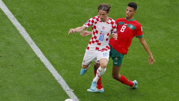 Morocco's midfielder #08 Azzedine Ounahi (R) fights for the ball with Croatia's midfielder #10 Luka Modric (L) during the Qatar 2022 World Cup Group F football match between Morocco and Croatia at the Al-Bayt Stadium in Al Khor, north of Doha on November 23, 2022. (Photo by Odd ANDERSEN / AFP)