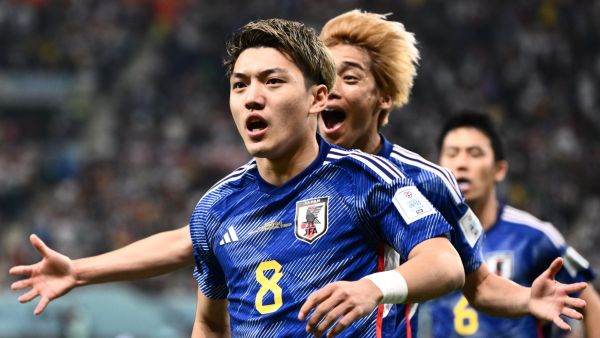 Japan's midfielder #08 Ritsu Doan celebrates scoring his team's first goal during the Qatar 2022 World Cup Group E football match between Germany and Japan at the Khalifa International Stadium in Doha on November 23, 2022. (Photo by Jewel SAMAD / AFP)