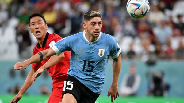 Uruguay's midfielder #15 Federico Valverde watches the ball past South Korea's midfielder #05 Jung Woo-young during the Qatar 2022 World Cup Group H football match between Uruguay and South Korea at the Education City Stadium in Al-Rayyan, west of Doha on November 24, 2022. (Photo by JUNG Yeon-je / AFP)