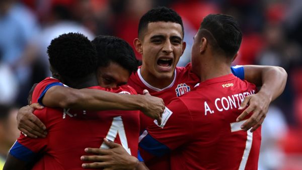 Costa Rica's players celebrate after winning the Qatar 2022 World Cup Group E football match between Japan and Costa Rica at the Ahmad Bin Ali Stadium in Al-Rayyan, west of Doha on November 27, 2022. (Photo by Philip FONG / AFP)