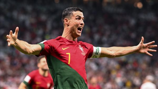Portugal's forward #07 Cristiano Ronaldo celebrates scoring his team's first goal during the Qatar 2022 World Cup Group H football match between Portugal and Uruguay at the Lusail Stadium in Lusail, north of Doha on November 28, 2022. FIFA later attributed the goal to Portugal's midfielder #08 Bruno Fernandes. (Photo by Kirill KUDRYAVTSEV / AFP)