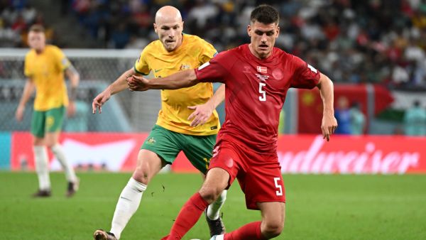 Australia's midfielder #13 Aaron Mooy (L) and Denmark's defender #05 Joakim Maehle fight for the ball during the Qatar 2022 World Cup Group D football match between Australia and Denmark at the Al-Janoub Stadium in Al-Wakrah, south of Doha on November 30, 2022. (Photo by NATALIA KOLESNIKOVA / AFP)