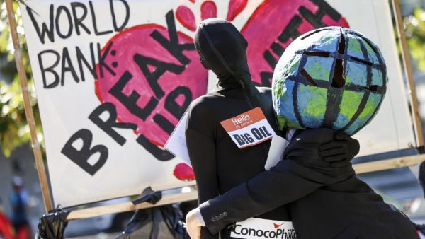 Climate activists rally against the use of fossil fuels outside of the World Bank Headquarters on October 14, 2022 in Washington, DC. Kevin Dietsch/Getty Images/AFP Climate activists
