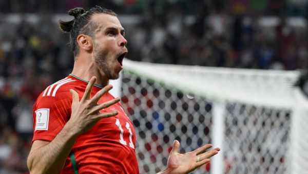 Wales' forward #11 Gareth Bale celebrates scoring his team's first goal during the Qatar 2022 World Cup Group B football match between USA and Wales at the Ahmad Bin Ali Stadium in Al-Rayyan, west of Doha on November 21, 2022. (Photo by NICOLAS TUCAT / AFP)