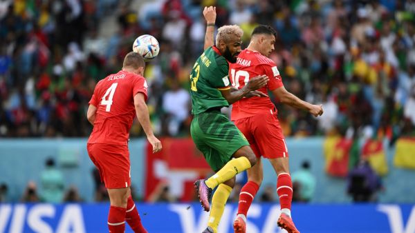 Cameroon's forward #13 Eric Maxim Choupo-Moting (C) fights for the ball with Switzerland's defender #04 Nico Elvedi (L) and Switzerland's midfielder #10 Granit Xhaka during the Qatar 2022 World Cup Group G football match between Switzerland and Cameroon at the Al-Janoub Stadium in Al-Wakrah, south of Doha on November 24, 2022. (Photo by Fabrice COFFRINI / AFP)