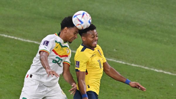 Senegal's defender #22 Abdou Diallo (L) jumps for the ball with Ecuador's forward #11 Michael Estrada during the Qatar 2022 World Cup Group A football match between Ecuador and Senegal at the Khalifa International Stadium in Doha on November 29, 2022. (Photo by JUNG Yeon-je / AFP)