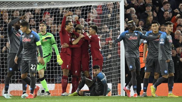 Liverpool's Egyptian striker Mohamed Salah celebrates scoring his team's first goal with teammates during the UEFA Champions League group A football match between Liverpool and Napoli in Liverpool, north west England on November 1, 2022. (Photo by Oli SCARFF / AFP)