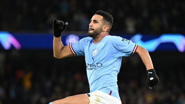 Manchester City's Algerian midfielder Riyad Mahrez celebrates scoring his team's third goal during the UEFA Champions League group G football match between Manchester City and Sevilla at the Etihad Stadium in Manchester, north west England on November 2, 2022. (Photo by Oli SCARFF / AFP)