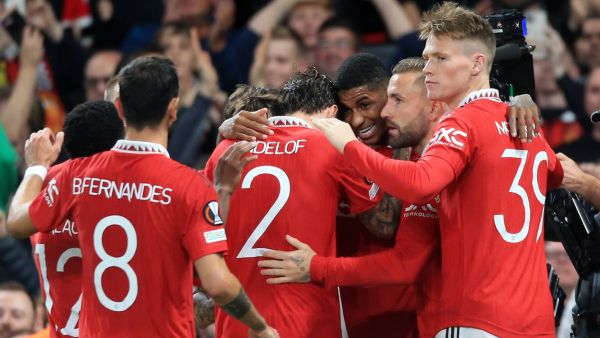Manchester United's English striker Marcus Rashford (3R) is mobbed by teammates after scoring the team's second goal during the UEFA Europa League Group E football match between Manchester United and Sheriff Tiraspol, at Old Trafford stadium, in Manchester, north-west England, on October 27, 2022. (Photo by Lindsey Parnaby / AFP)