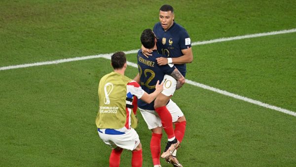  France's defender #22 Theo Hernandez hugs France's forward #10 Kylian Mbappe after scoring his team's first goal during the Qatar 2022 World Cup Group D football match between France and Denmark at Stadium 974 in Doha on November 26, 2022. (Photo by Anne-Christine POUJOULAT / AFP)
