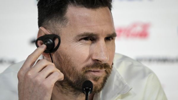 Argentina's forward Lionel Messi reacts as he gives a press conference at the Qatar National Convention Center (QNCC) in Doha, on November 21, 2022, on the eve of the Qatar 2022 World Cup football match between Argentina and Saudi Arabia. (Photo by JUAN MABROMATA / AFP)