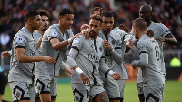 Paris Saint-Germain's Brazilian forward Neymar (C) is congratulated by Paris Saint-Germain's French forward Hugo Ekitike (L) and Paris Saint-Germain's French forward Kylian Mbappe after scoring his team's first goal during the French L1 football match between FC Lorient and Paris Saint Germain (PSG) at Stade du Moustoir in Lorient, western France on November 6, 2022. (Photo by JEAN-FRANCOIS MONIER / AFP)