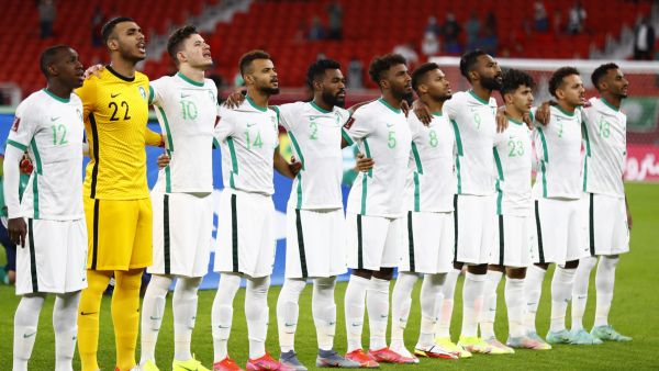 Saudi Arabia's players sing their national anthem ahead of during the FIFA Arab Cup 2021 group C football match between Morocco and Saudi Arabia at the Al-Thumama Stadium in the capital city of Doha on December 7, 2021. (Photo by Khaled DESOUKI / AFP)