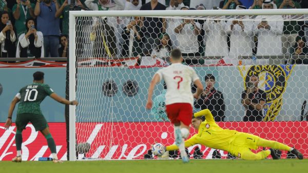 Poland's goalkeeper #01 Wojciech Szczesny stops a penalty by Saudi Arabia's midfielder #10 Salem Al-Dawsari during the Qatar 2022 World Cup Group C football match between Poland and Saudi Arabia at the Education City Stadium in Al-Rayyan, west of Doha on November 26, 2022. (Photo by Odd ANDERSEN / AFP)