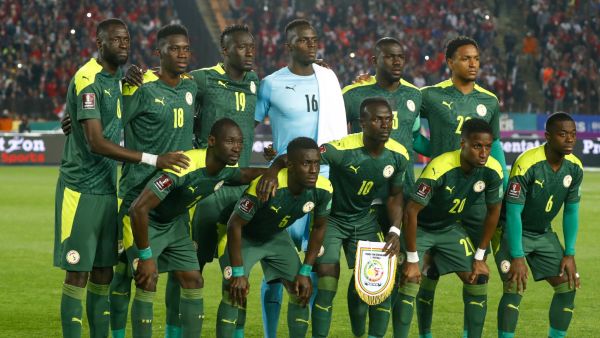 Senegal's starting eleven (top L to R) midfielder Cheikhou Kouyate, forward Ismaila Sarr, forward Famara Diedhiou, goalkeeper Edouard Mendy, defender and captain Kalidou Koulibaly, defender Abdou Diallo, (bottom L to R) defender Saliou Ciss, midfielder Idrissa Gueye, forward Sadio Mane, defender Bouna Sarr, and midfielder Nampalys Mendy pose for a group photo before the start of the 2022 Qatar World Cup African Qualifiers football match between Egypt and Senegal at Cairo International Stadium in the Egyptia