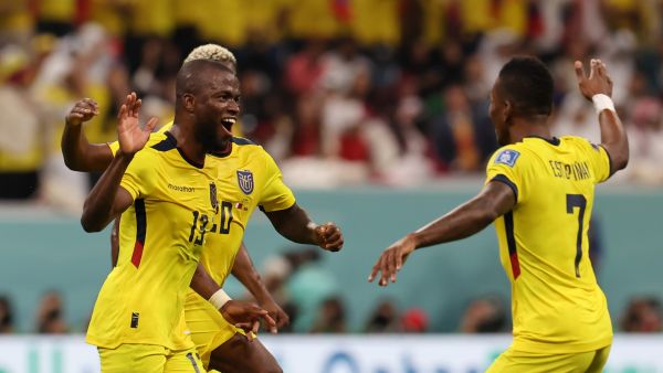 Ecuador's forward #13 Enner Valencia (L) celebrates with Ecuador's defender #07 Pervis Estupinan after he scored his team's second goal during the Qatar 2022 World Cup Group A football match between Qatar and Ecuador at the Al-Bayt Stadium in Al Khor, north of Doha on November 20, 2022. (Photo by KARIM JAAFAR / AFP)