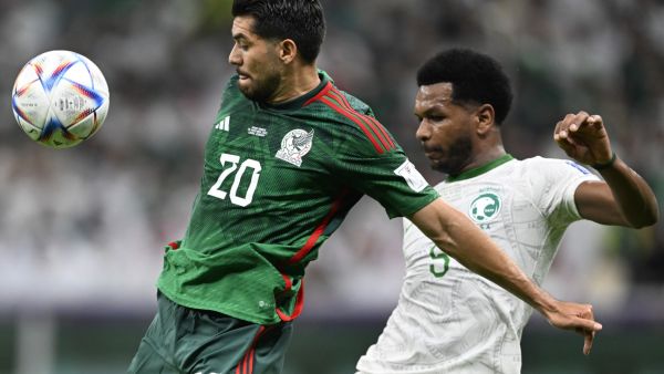 Saudi Arabia's defender #05 Ali Al-Bulaihi (R) fights for the ball with Mexico's forward #20 Henry Martin (L) during the Qatar 2022 World Cup Group C football match between Saudi Arabia and Mexico at the Lusail Stadium in Lusail, north of Doha on November 30, 2022. (Photo by PATRICIA DE MELO MOREIRA / AFP)