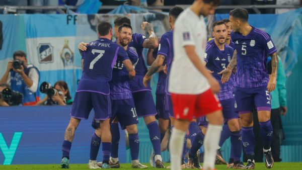 Argentina players celebrates their team's second goal during the Qatar 2022 World Cup Group C football match between Poland and Argentina at Stadium 974 in Doha on November 30, 2022. (Photo by Odd ANDERSEN / AFP)