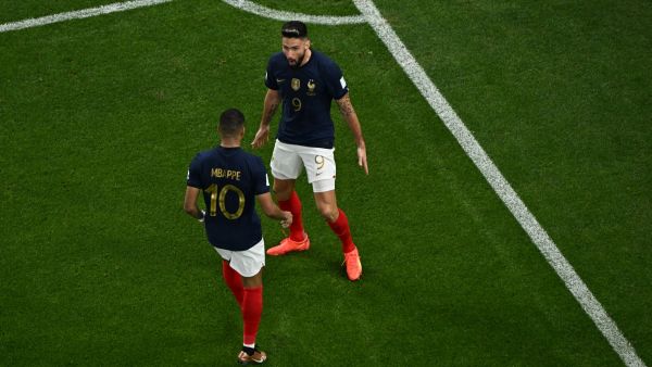 France's forward #09 Olivier Giroud celebrates with France's forward #10 Kylian Mbappe after scoring his team's first goal during the Qatar 2022 World Cup round of 16 football match between France and Poland at the Al-Thumama Stadium in Doha on December 4, 2022. (Photo by MANAN VATSYAYANA / AFP)