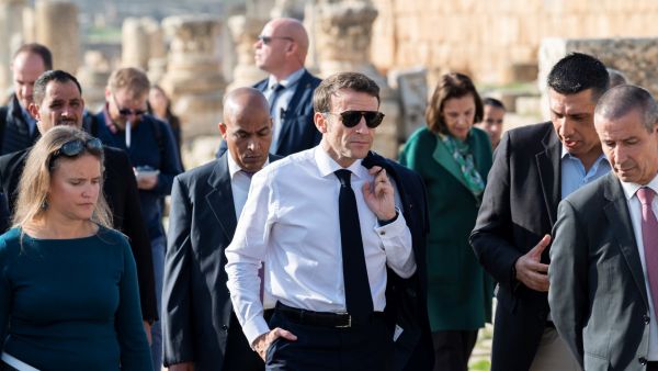 French President Emmanuel Macron (C) visits the archaeological site of Jerash, on December 21, 2022. (Photo by Eliot BLONDET / POOL / AFP) French President Emmanuel Macron