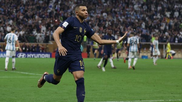France's forward #10 Kylian Mbappe celebrates scoring his team's third goal from the penalty spot during the Qatar 2022 World Cup final football match between Argentina and France at Lusail Stadium in Lusail, north of Doha on December 18, 2022. (Photo by ADRIAN DENNIS / AFP)