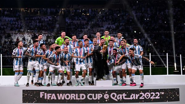 Argentina's forward #10 Lionel Messi lifts the FIFA World Cup Trophy as he celebrates with teammates winning the Qatar 2022 World Cup final football match between Argentina and France at Lusail Stadium in Lusail, north of Doha on December 18, 2022. (Photo by Kirill KUDRYAVTSEV / AFP)
