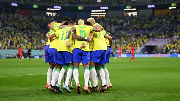 Brazil's forward #10 Neymar (C) celebrates with teammates after he scored his team's second goal from the penalty spot during the Qatar 2022 World Cup round of 16 football match between Brazil and South Korea at Stadium 974 in Doha on December 5, 2022. (Photo by MANAN VATSYAYANA / AFP)