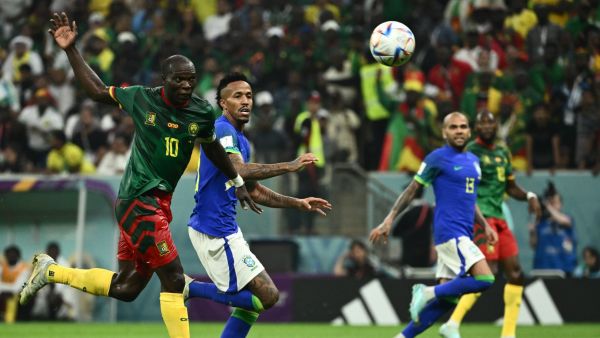 Cameroon's forward #10 Vincent Aboubakar (L) scores his team's first goal during the Qatar 2022 World Cup Group G football match between Cameroon and Brazil at the Lusail Stadium in Lusail, north of Doha on December 2, 2022. (Photo by Jewel SAMAD / AFP)