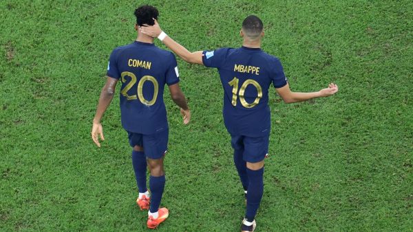 France's forward #10 Kylian Mbappe (R) consoles France's forward #20 Kingsley Coman (L) after Coman missed in the penalty shoot-out during the Qatar 2022 World Cup final football match between Argentina and France at Lusail Stadium in Lusail, north of Doha on December 18, 2022. (Photo by Giuseppe CACACE / AFP)