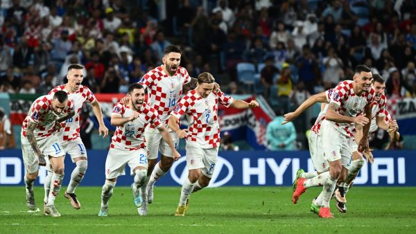 Croatia players celebrate after they won the Qatar 2022 World Cup round of 16 football match between Japan and Croatia at the Al-Janoub Stadium in Al-Wakrah, south of Doha on December 5, 2022. (Photo by Jewel SAMAD / AFP)